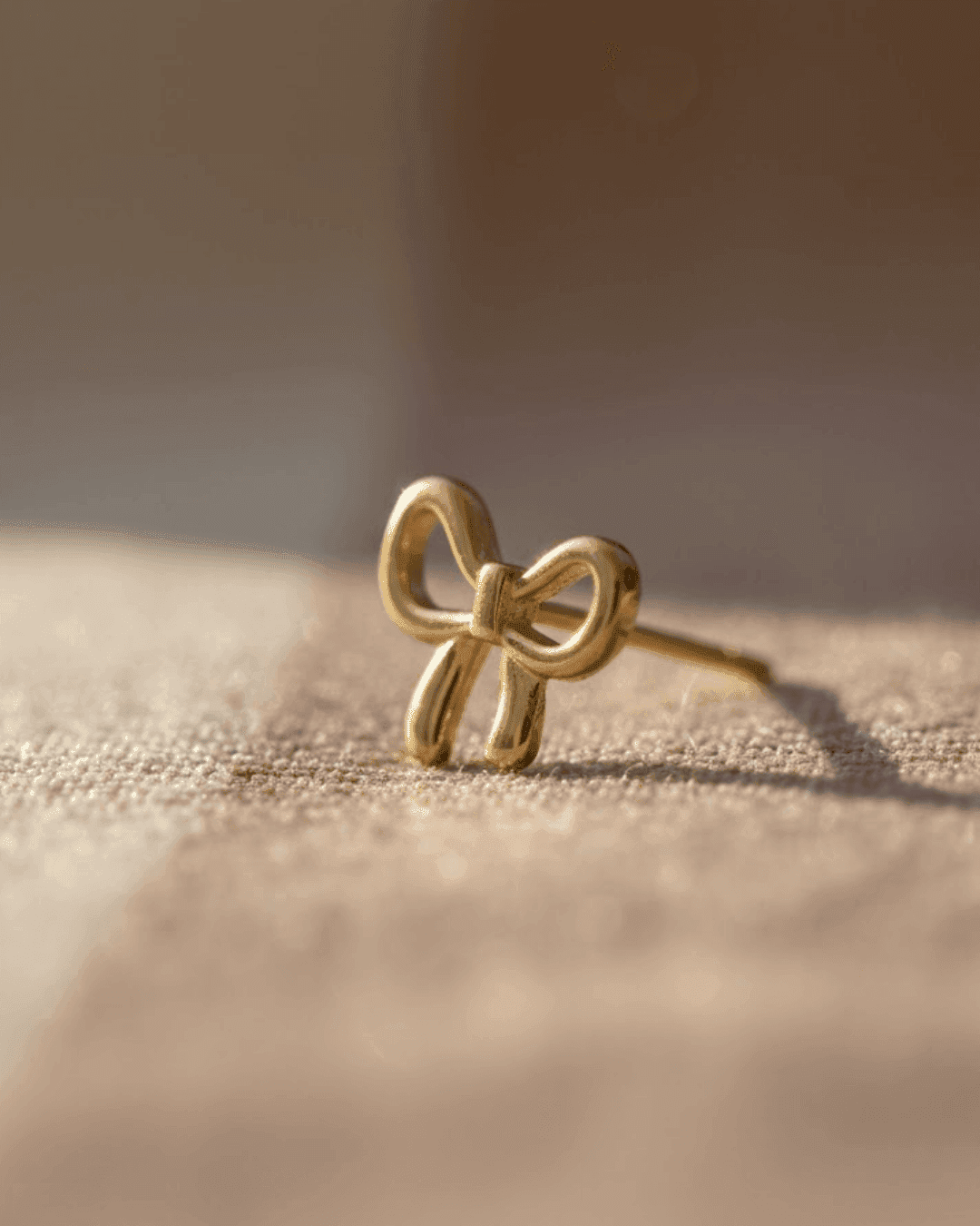 Dainty Gold Bow Stud Earrings - view 1